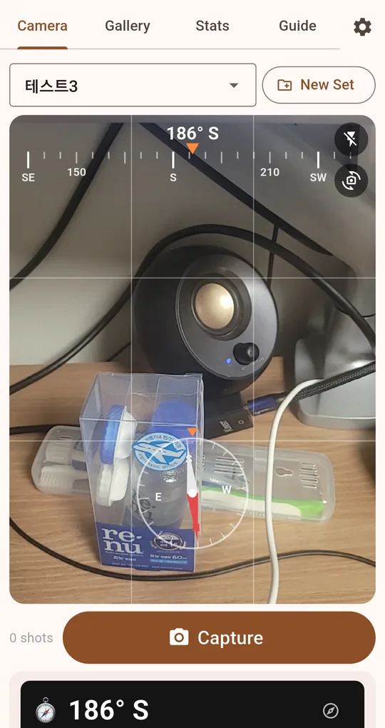 Camera screen with 186° S at the bottom and a compass icon to its right