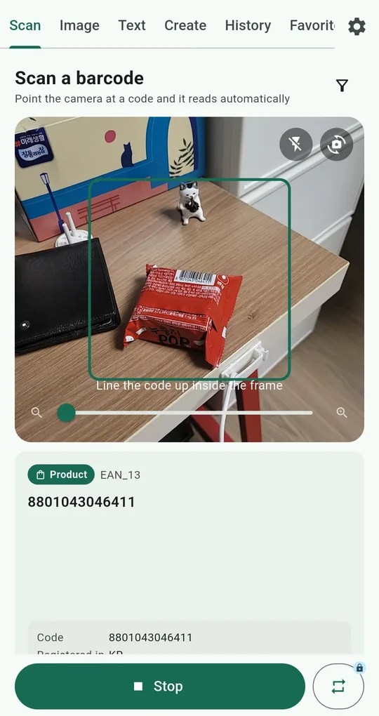 QR and Barcode Scanner scan screen with a zoom slider at the bottom and torch and camera-switch buttons at the top right